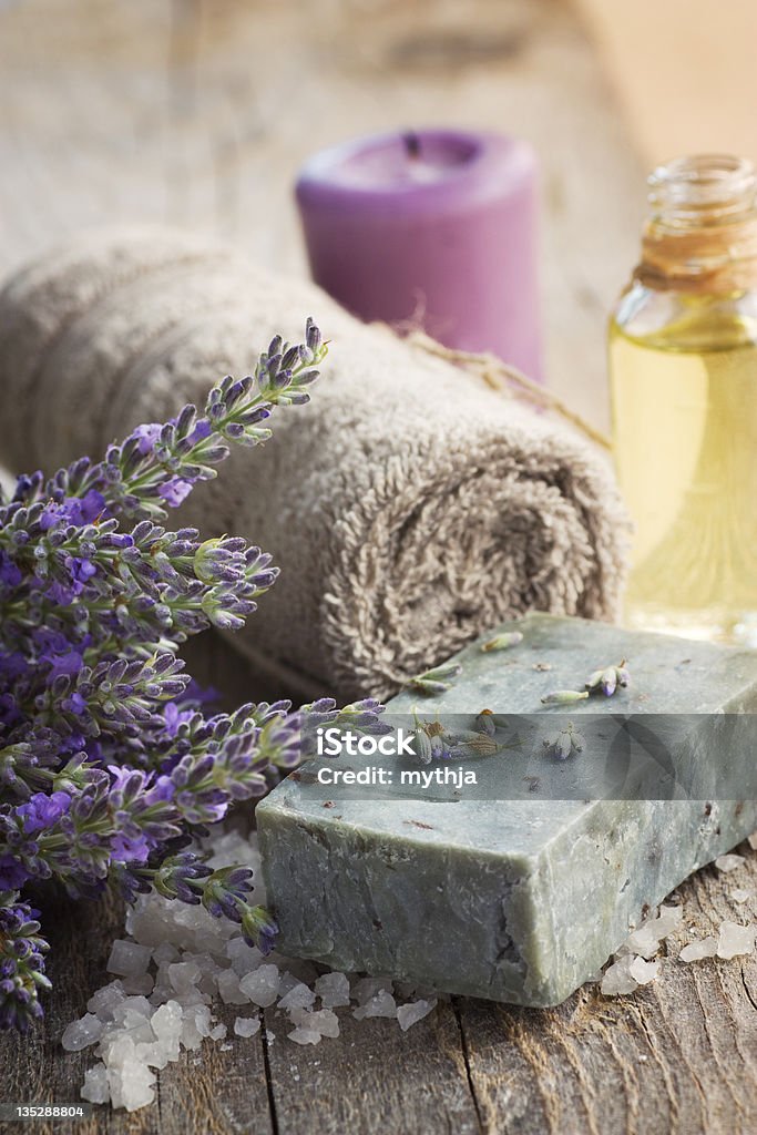 Spa with lavender and towel Spa setting with lavender, towel and natural soap Aromatherapy Oil Stock Photo