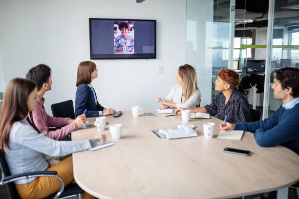 istock Staff having video call meeting in conference room 1352889518