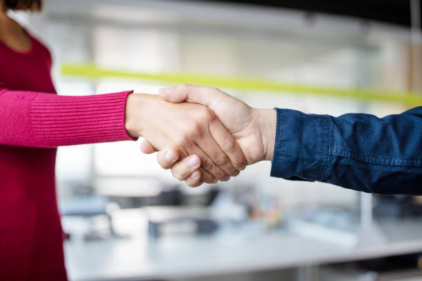 istock Close-up of business professional shaking hands at work 1352891277
