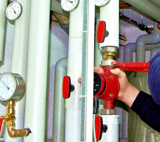istock Heating emergency service, plumber repairing heating 1352891342
