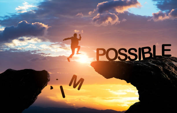 Businessman jumping cliff change impossible to possible Businessman jumping cliff change impossible to possible. impossible possible stock pictures, royalty-free photos & images