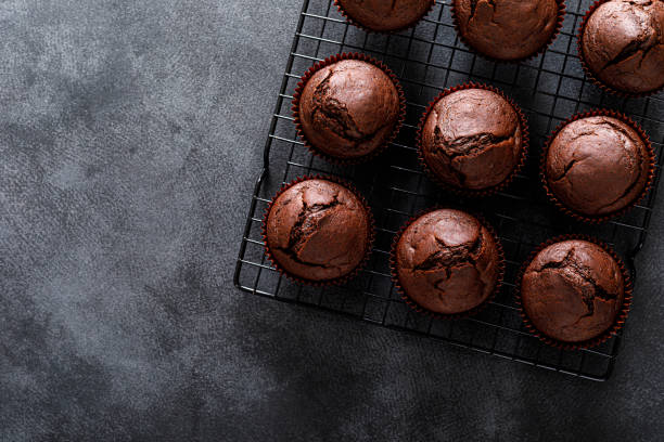 istock Chocolate muffins on dark background. Top view. 1352898816