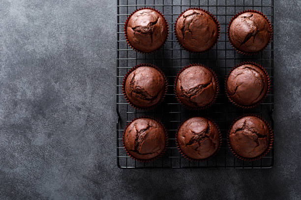 istock Chocolate muffins on dark background. Top view. 1352898979