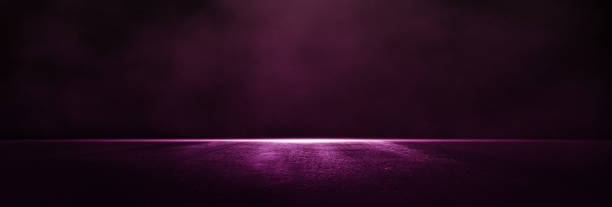 istock Purple empty dark scene with light and smoke. 1352900252