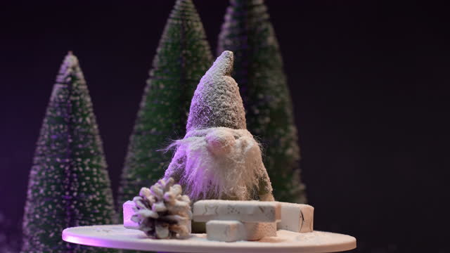 Elf figurine surrounded with Christmas tree