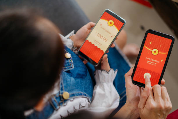 istock Young girl receive digital red envelope sent via smartphone 1352902735