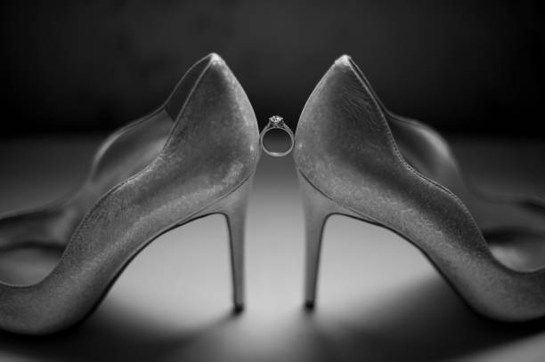 istock Wedding Shoes Heels Engagement Ring Black And White Grey Shadow 1352903129