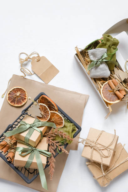 istock Christmas gift. gift box,zero waste, eco friendly hand made box packaging gifts in kraft paper table, eco christmas holiday concept, Christmas gift wrapping,eco decor banner 1352905013