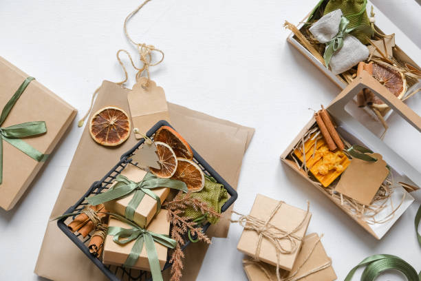 istock Christmas gift. gift box,zero waste, eco friendly hand made box packaging gifts in kraft paper table, eco christmas holiday concept, Christmas gift wrapping,eco decor banner 1352905649