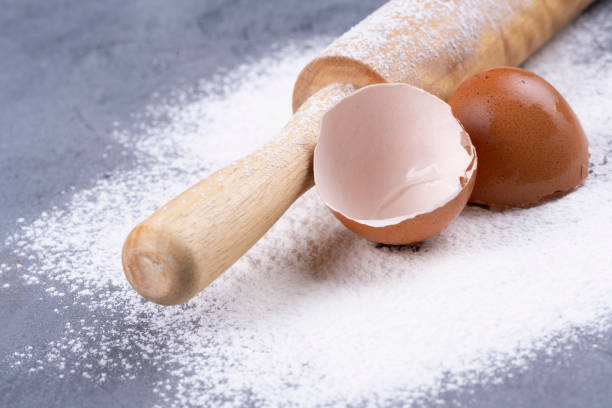 istock flour and wooden rolling pin on a gray concrete stone table 1352906059