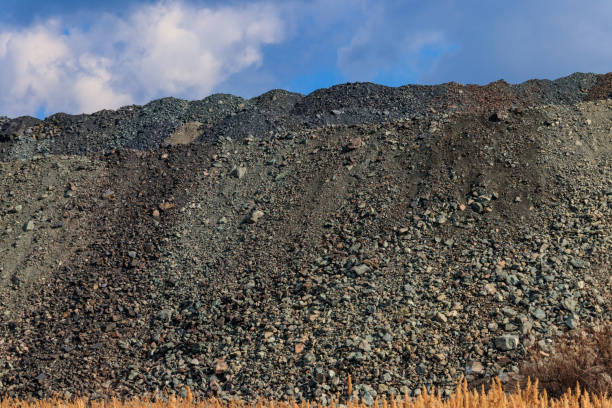 View of slag heaps of iron ore quarry. Mining industry View of slag heaps of iron ore quarry. Mining industry Slag Remover stock pictures, royalty-free photos & images