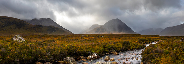 Stunning panoramic view across the River Etive towards Buachaille Etive Mor, in the Glen Etive area of Glencoe in the Highlands in Scotland, UK.