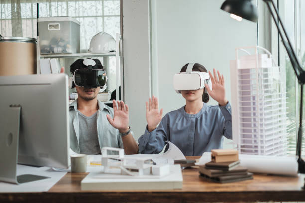 istock Architect wearing virtual reality headset for detail project house model. 1352906567