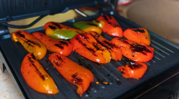 istock juicy red pepper made on an electric grill, close-up 1352908967