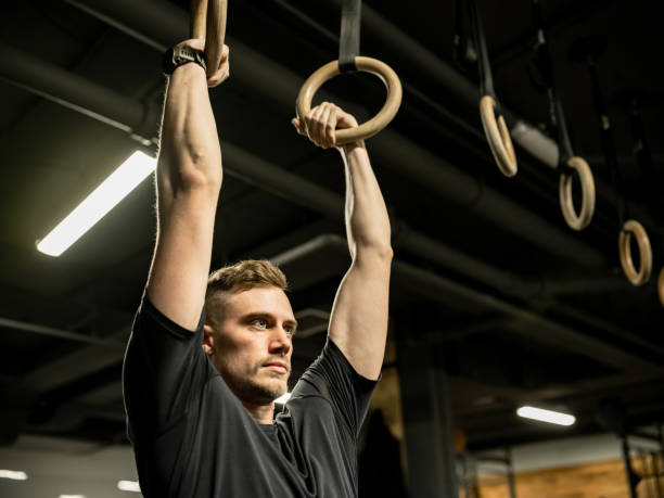 istock Man exercising in the Gym 1352910050