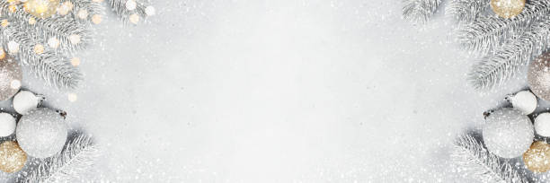 istock Christmas grey banner with frosted Christmas tree branches and baubles 1352910280