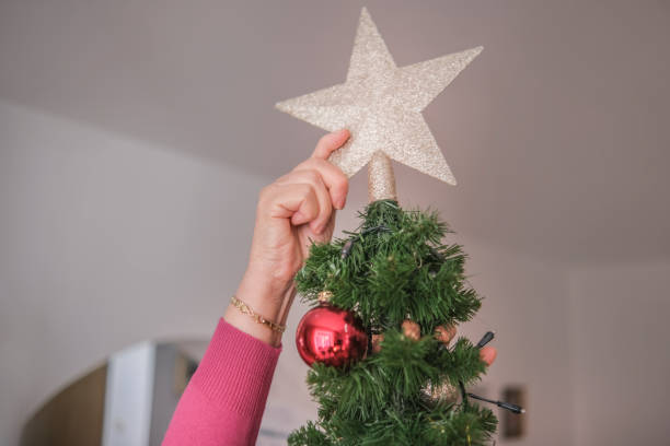 istock Christmas star on top of the tree 1352910281