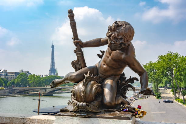 istock Statue on Alexander III bridge and Eiffel Tower at background, Paris, France 1352910492