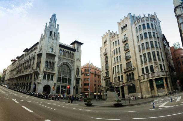 2018 June 5. Spain. Barcelona. It was getting dark, people went home. The streets became deserted. But then the green light came on and they were filled with the hum of cars and scooters.