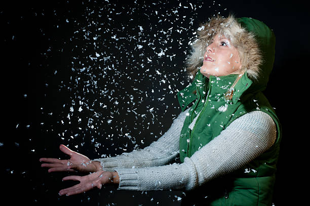 girl catching snowflakes