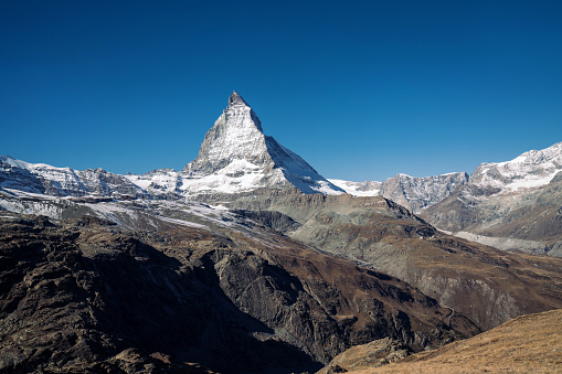 view of the famous Matterhorn peak of Swiss Alps on sunny autumn day