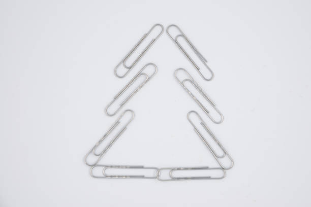 Fir tree made of paper clips - isolated on white background