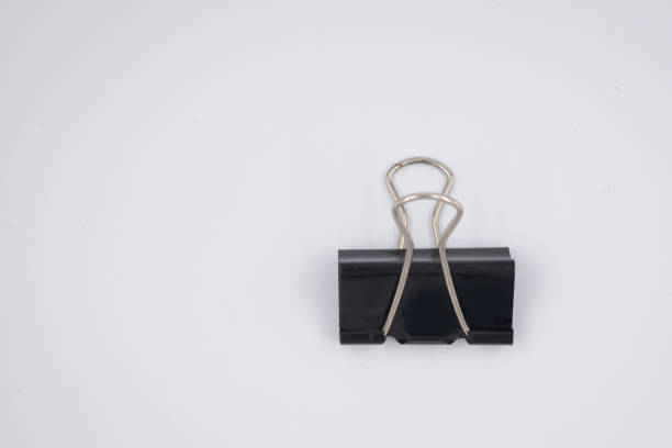 istock Black Paper clip isolated on white background. 1352912706
