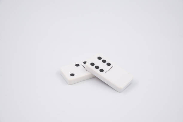 Two classic domino tiles on white background
