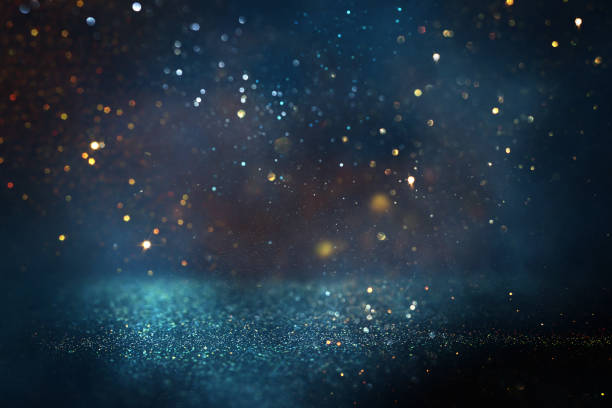 istock background of abstract glitter lights. gold, blue and black. de focused 1352912895