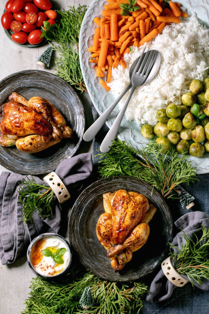 istock Christmas dinner table with grilled chicken, rice and vegetables 1352913633