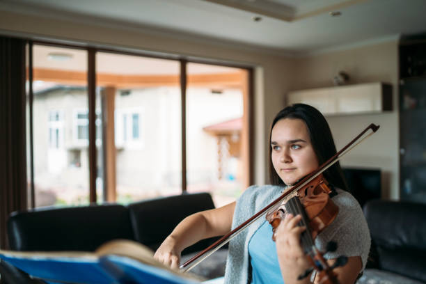 istock Violinist playing music 1352920460