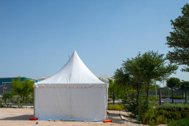 istock Tent in a field under the sunny sky 1352923629