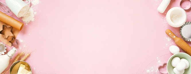 Pink banner with raw ingredients for baking, traditional cookies or cakes, top view composition, copy space