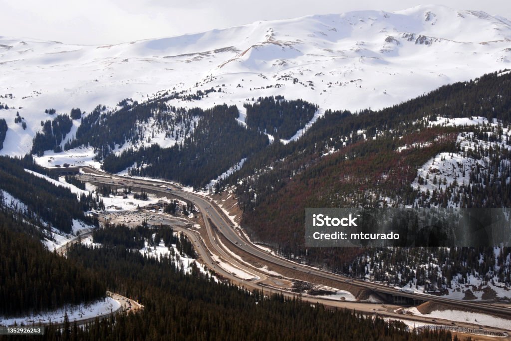 Loveland Ski Area and Eisenhower Tunnel on the I-70, Colorado, USA Loveland, Larimer County, Colorado, USA: Loveland Ski Area - winter view with snow on the mountains and the I-70 interstate road in the valley entering Eisenhower Tunnel, it carries Interstate 70 (I-70) under the Continental Divide in the Rocky Mountains - Arapaho National Forest. Colorado Stock Photo