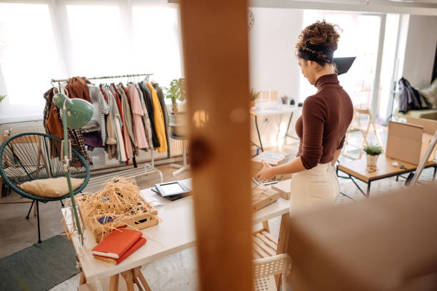 istock Woman getting ready the shipping packages 1352926780
