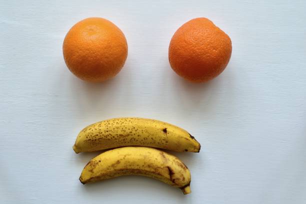 istock Funny face made of fruits on the table 1352930006