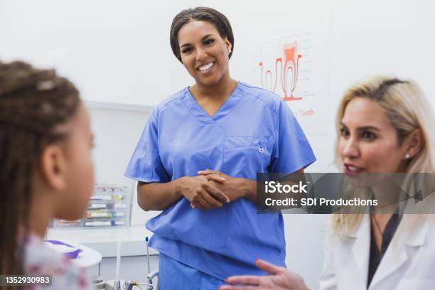 Pediatric Dentists Talks About Girls Dental Health Stock Photo - Download Image Now