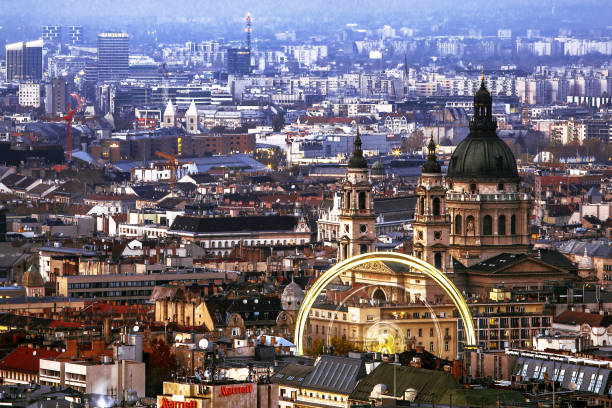 istock Blurred panoramic wheels of Budapest and St Istvan Basilica at sunset, Hungary 1352931289