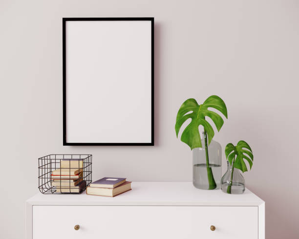 istock Vertical frame mockup in modern interior background. Empty frame above white chest of drawers with beautiful decor. Scandinavian style, frame mockup, 3d rendering 1352931528