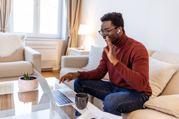 istock Cute handsome African American guy social distancing at home 1352932559