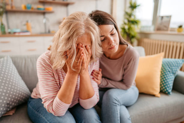 istock Daughter comfort her mother 1352932811