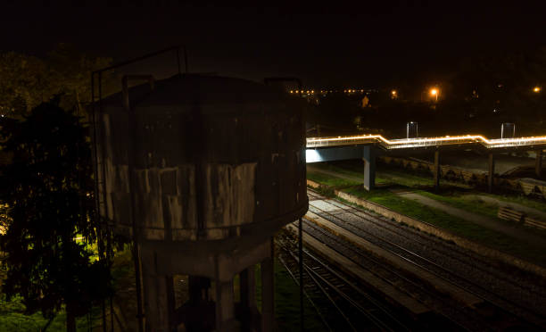 istock Old aqueduct and a footbridge over rails 1352932942