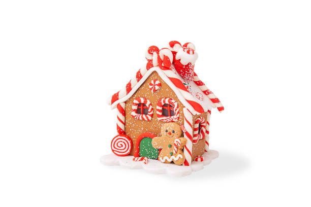 Christmas gingerbread house decorated with colored glaze, isolated on a white background.