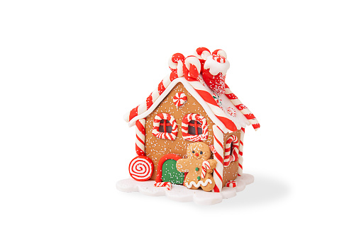 Christmas gingerbread house decorated with colored glaze, isolated on a white background