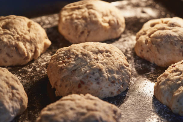 istock Loaf of whole wheat bread leavening. selective focus 1352934372
