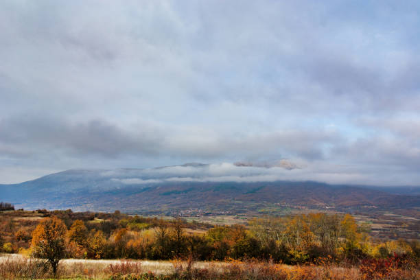 istock Forest and mountain on a cold cloudy autumn day 1352936695