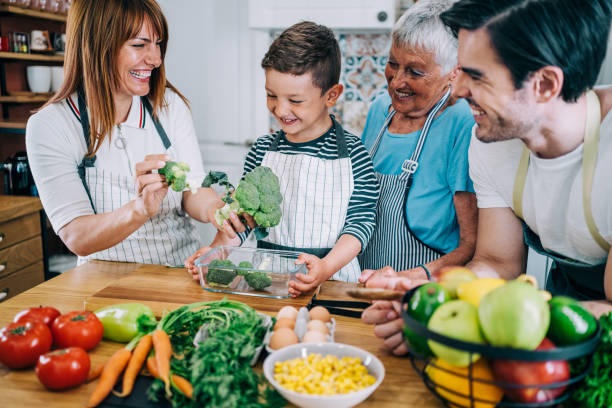 istock Multi-generation family having fun in the kitchen. 1352937976