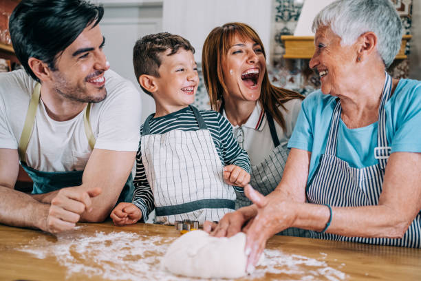 istock Multi-generation family having fun in the kitchen. 1352938075