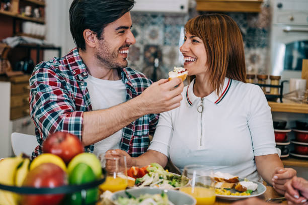 istock Young couple sharing food. 1352938088