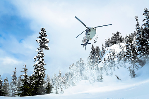 Travel by helicopter in the mountains. Scenic flight.
